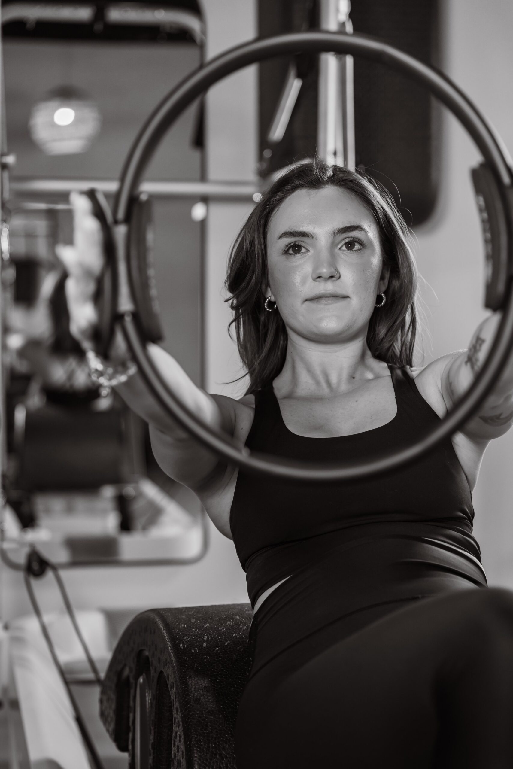 pilates instructor uses magic circle pilates